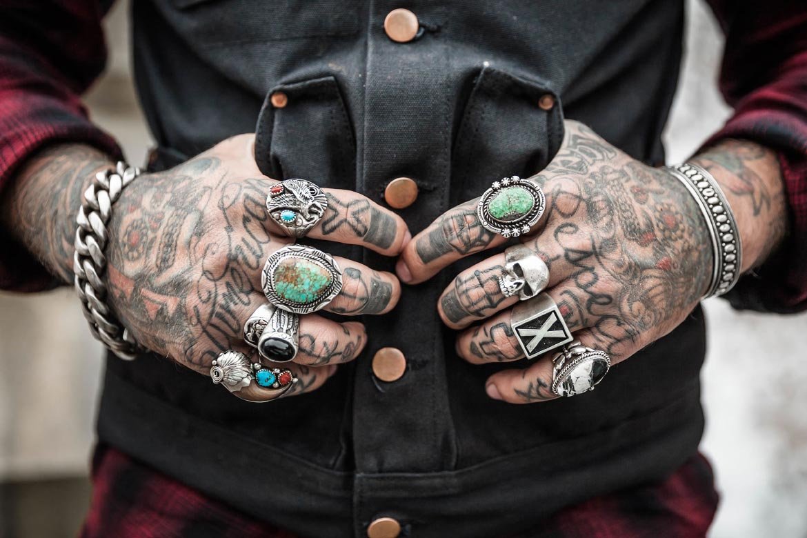 Tattoo's hands with Thumbs in Jacket Pocket